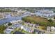 Aerial view of a neighborhood on a river with a bridge in the distance and a pond to the left of the home at 1010 Club House Dr., North Myrtle Beach, SC 29582