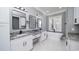 Elegant bathroom featuring dual vanities with granite countertops and a freestanding soaking tub at 1010 Club House Dr., North Myrtle Beach, SC 29582