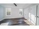 Bedroom with hardwood floors, base-molding and large windows that bring in plenty of natural light at 1010 Club House Dr., North Myrtle Beach, SC 29582