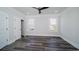 Bright bedroom with hardwood floors, recessed lighting, and windows offering outdoor views at 1010 Club House Dr., North Myrtle Beach, SC 29582
