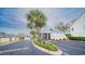 Community dock entrance with palm trees and a gazebo, with the waterway and condos in the background at 1010 Club House Dr., North Myrtle Beach, SC 29582