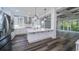 Modern kitchen features stainless steel appliances, white cabinetry, and spacious island at 1010 Club House Dr., North Myrtle Beach, SC 29582
