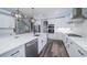 Bright kitchen with white cabinets, modern appliances, and quartz countertops at 1010 Club House Dr., North Myrtle Beach, SC 29582