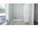 Bright laundry room with storage cabinets and a window for natural light at 1010 Club House Dr., North Myrtle Beach, SC 29582