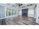 Open-concept living room with coffered ceilings, fireplace, and sliding doors to the balcony at 1010 Club House Dr., North Myrtle Beach, SC 29582