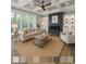 Cozy living room with fireplace, decorative shelves, and large windows showcasing the outdoor view at 1010 Club House Dr., North Myrtle Beach, SC 29582