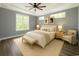 The main bedroom is spacious and inviting, featuring a ceiling fan and ample natural light at 1010 Club House Dr., North Myrtle Beach, SC 29582