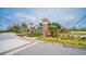 Community entrance sign for Sunset Harbour with colorful landscaping, brick pillars and a manicured lawn at 1010 Club House Dr., North Myrtle Beach, SC 29582
