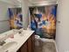 Bathroom featuring a double sink, a large mirror, and a beach themed shower curtain at 1060 Fairway Ln. # 1060, Conway, SC 29526