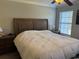 Comfortable main bedroom with carpet floor, ceiling fan, and window at 1060 Fairway Ln. # 1060, Conway, SC 29526