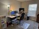 Home office space with a desk, rolling chair, two monitors, and natural light at 1060 Fairway Ln. # 1060, Conway, SC 29526