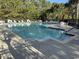 Community pool featuring lounge chairs and tables for relaxing poolside at 1060 Fairway Ln. # 1060, Conway, SC 29526