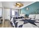 Cozy bedroom with two beds, side table, and a window with curtains for privacy at 2001 S Ocean Blvd. # 1506, Myrtle Beach, SC 29577