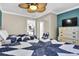 Bedroom with ceiling fan, and a view of the kitchen and hallway for convenience at 2001 S Ocean Blvd. # 1506, Myrtle Beach, SC 29577