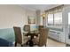 Bright dining area with a glass table, wicker chairs and natural light at 2001 S Ocean Blvd. # 1506, Myrtle Beach, SC 29577