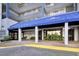Welcoming entrance to the condo building with awning and landscaped accents for a luxurious feel at 2001 S Ocean Blvd. # 1506, Myrtle Beach, SC 29577