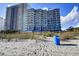 Beachside condo building with a view of the ocean and beach access at 2001 S Ocean Blvd. # 1506, Myrtle Beach, SC 29577