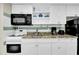 Updated kitchen with granite counters, white cabinets, and modern appliances at 2001 S Ocean Blvd. # 1506, Myrtle Beach, SC 29577