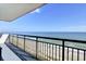 Balcony view overlooking a beach with sunbathers on a clear sunny day at 2001 S Ocean Blvd. # 905, Myrtle Beach, SC 29577