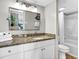 Bathroom featuring granite countertop, white vanity and a shower-tub combination at 2001 S Ocean Blvd. # 905, Myrtle Beach, SC 29577