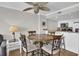 Dining area features a wooden table with seating for four, plus views of the kitchen at 2001 S Ocean Blvd. # 905, Myrtle Beach, SC 29577