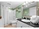 Bright bathroom with a shower/tub combo and sleek vanity with black countertop at 2151 Bridge View Ct. # 2502, North Myrtle Beach, SC 29582