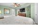Comfortable bedroom features two beds, a TV, and a glimpse into the bathroom at 2151 Bridge View Ct. # 2502, North Myrtle Beach, SC 29582