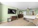 Inviting bedroom featuring a TV, dark wood furniture, and a view of the bathroom at 2151 Bridge View Ct. # 2502, North Myrtle Beach, SC 29582