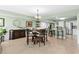 This dining area features a round table, seating for four, and a view of the modern kitchen at 2151 Bridge View Ct. # 2502, North Myrtle Beach, SC 29582