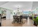 Open-concept living room with dining area showcasing sliding glass doors leading to a scenic intercostal balcony at 2151 Bridge View Ct. # 2502, North Myrtle Beach, SC 29582