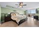 Serene main bedroom with balcony access, a ceiling fan, and dark wood furniture at 2151 Bridge View Ct. # 2502, North Myrtle Beach, SC 29582