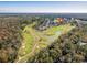 Panoramic aerial view of the community with lush golf courses, lakes, and tree-lined streets at 565 Bucks Trail, Longs, SC 29568