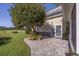 Backyard featuring a stone patio, lawn, and mature tree at 565 Bucks Trail, Longs, SC 29568