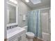 Cozy bathroom with tile floors, a shower/tub, and a white sink at 565 Bucks Trail, Longs, SC 29568