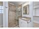 Beautiful bathroom with granite countertops, a tiled shower with glass door, and linen closet at 565 Bucks Trail, Longs, SC 29568