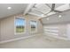 Spacious bedroom with neutral carpet, white trim, golf course views and decorative ceiling at 565 Bucks Trail, Longs, SC 29568