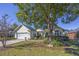 Charming single-story home featuring a well-manicured front yard and a two-car garage at 565 Bucks Trail, Longs, SC 29568