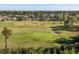 Scenic view of the community golf course showcasing a green, sand trap, and surrounding homes at 565 Bucks Trail, Longs, SC 29568