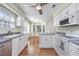 Bright kitchen with stainless steel appliances, white cabinets, and hardwood floors at 565 Bucks Trail, Longs, SC 29568