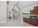 Bright open living space featuring a spiral staircase and a wet bar with granite countertops at 565 Bucks Trail, Longs, SC 29568