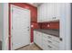 Mud Room featuring white cabinets, granite countertops, and a door to the outside at 565 Bucks Trail, Longs, SC 29568