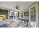 Cozy screened porch with brick flooring overlooking the backyard at 565 Bucks Trail, Longs, SC 29568