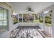Relaxing screened porch with stone flooring, offering a serene outdoor living space at 565 Bucks Trail, Longs, SC 29568