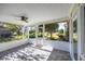 A screened porch with brick flooring and an overhead ceiling fan at 565 Bucks Trail, Longs, SC 29568