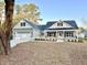 Inviting home featuring a black roof, black trim, and a light-colored siding at 1006 Cuttino St., Georgetown, SC 29440