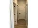 Hallway featuring white trim, doors, and vinyl wood flooring at 1006 Cuttino St., Georgetown, SC 29440