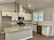 Bright kitchen featuring white cabinets, stainless appliances, and pendant lighting at 1006 Cuttino St., Georgetown, SC 29440
