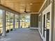 Inviting screened porch with wood paneled ceiling and multiple windows at 1006 Cuttino St., Georgetown, SC 29440
