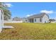 Spacious backyard featuring a well-maintained lawn and a partial view of the home's exterior at 131 Grissett Lake Dr., Conway, SC 29526