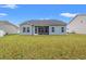 Spacious backyard featuring a screened-in porch and well-maintained lawn at 131 Grissett Lake Dr., Conway, SC 29526